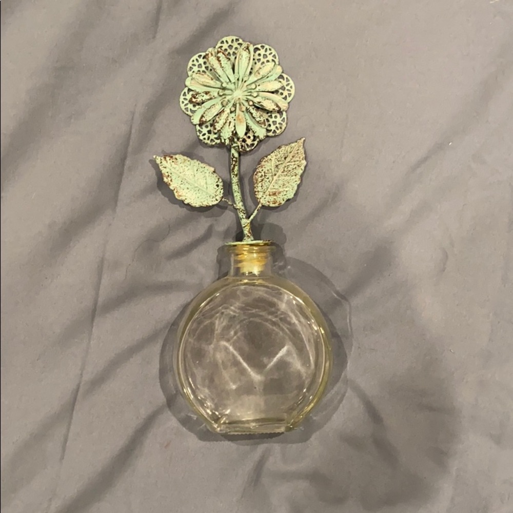 Decorative small glass vase with flower topper